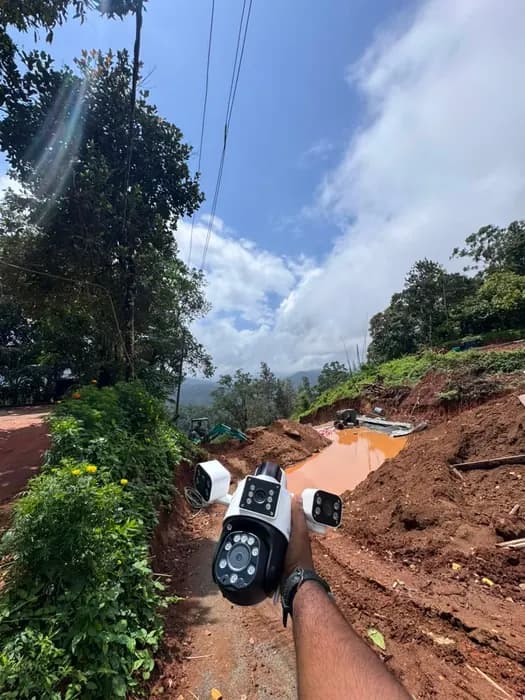 Dual-lens camera positioned on a hillside access track