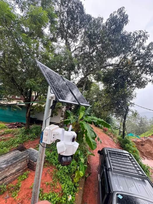 Pole-mounted solar camera covering a property approach